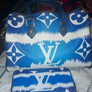 Blue and white tye dye Louis Vuitton purse with matching wallet.